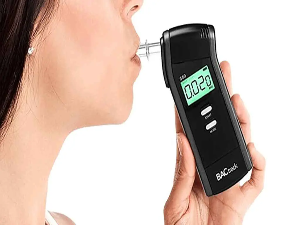 pre employment drugs and alcohol testing 2 A woman using a professional-grade breathalyser