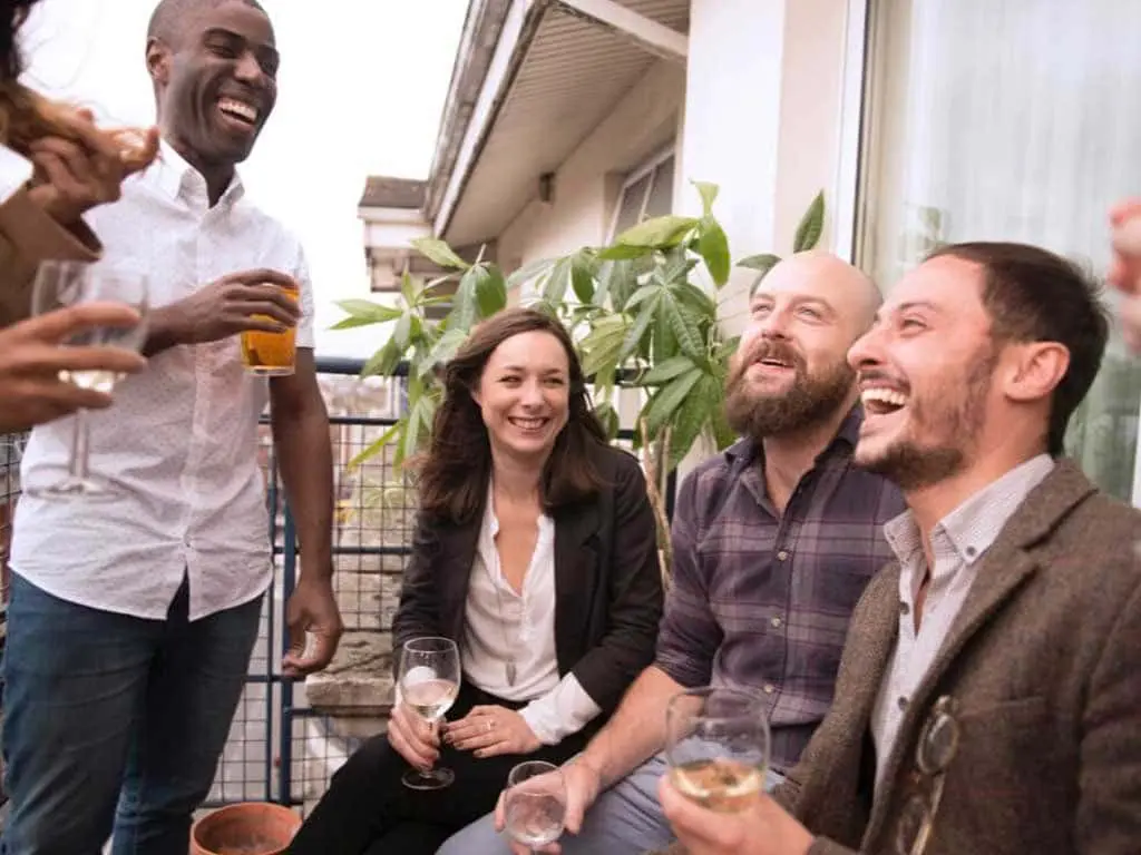 Group of people bonding over alcoholic drinks