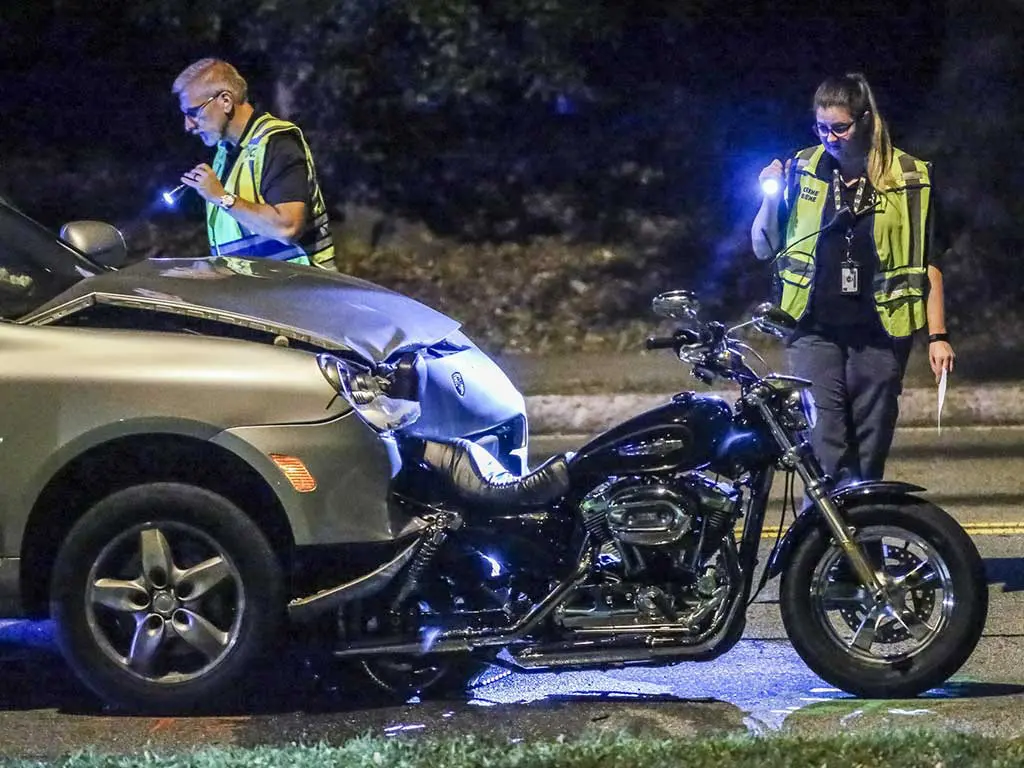 Two police officers checking on a road accident