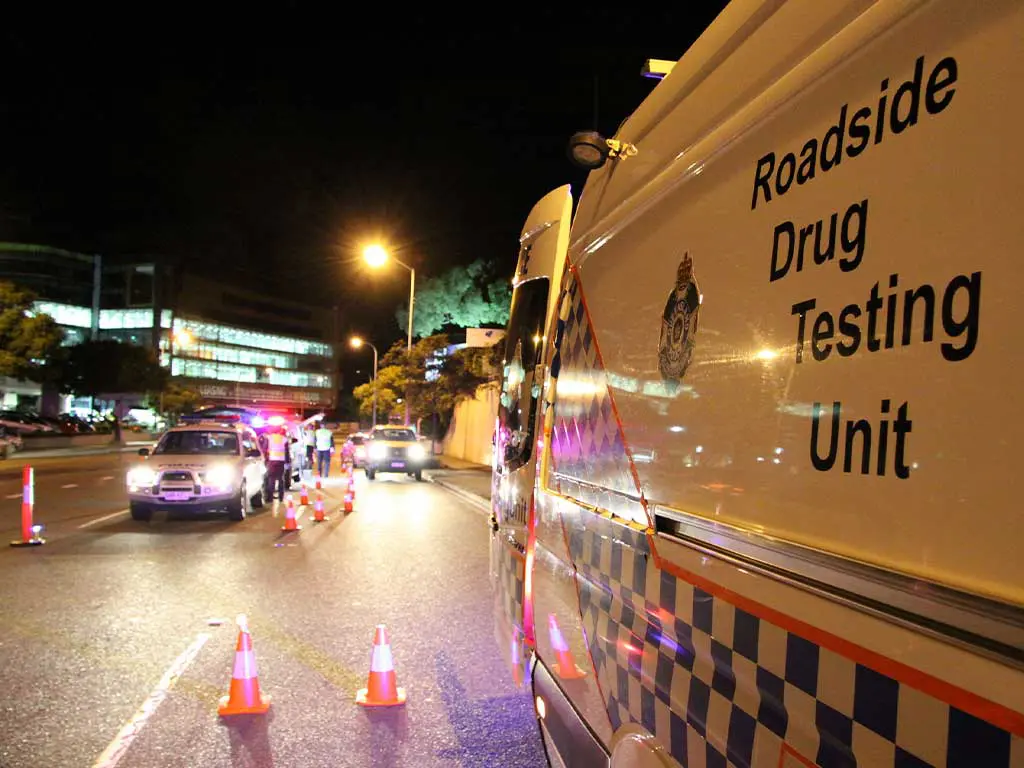 A roadside drug testing unit vehicle on the road