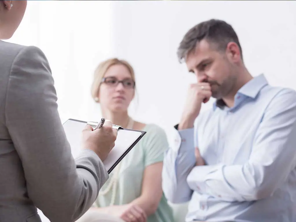 A safety representative talking to employees about a drug test result