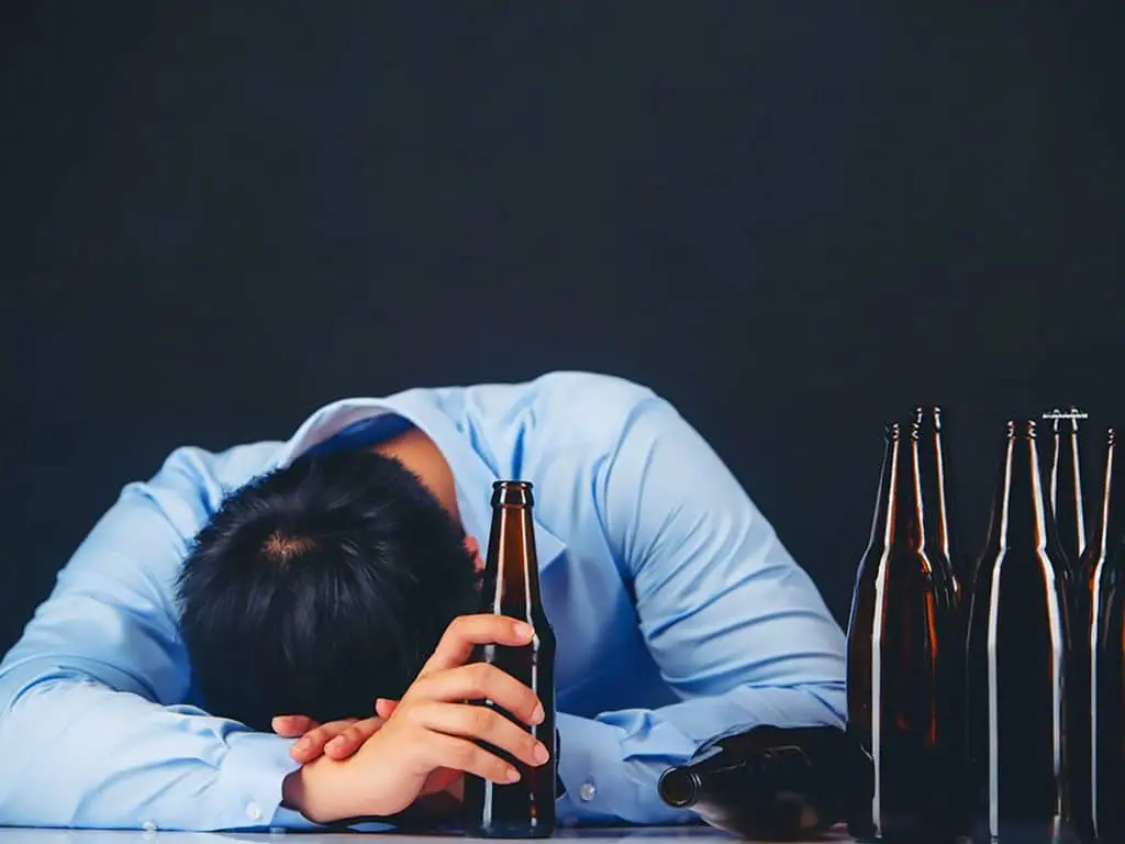 Man suffering from alcohol poisoning