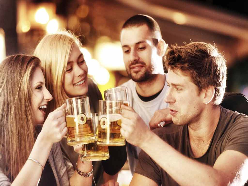 alcoholic employee 2 Four people drinking alcohol in a pub