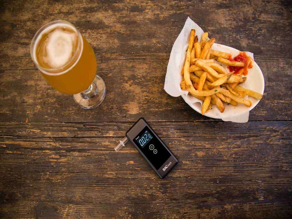 BACtrack trace beside fries and a cocktail