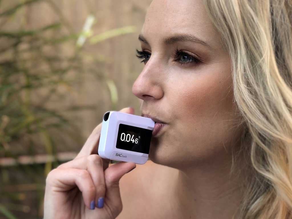 bac readings 1 Woman using a breathalyser