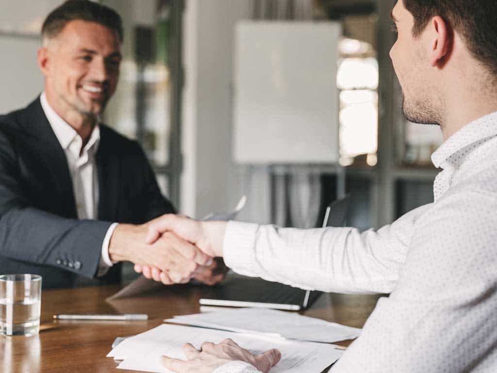 Passing a pre-employment test and interview