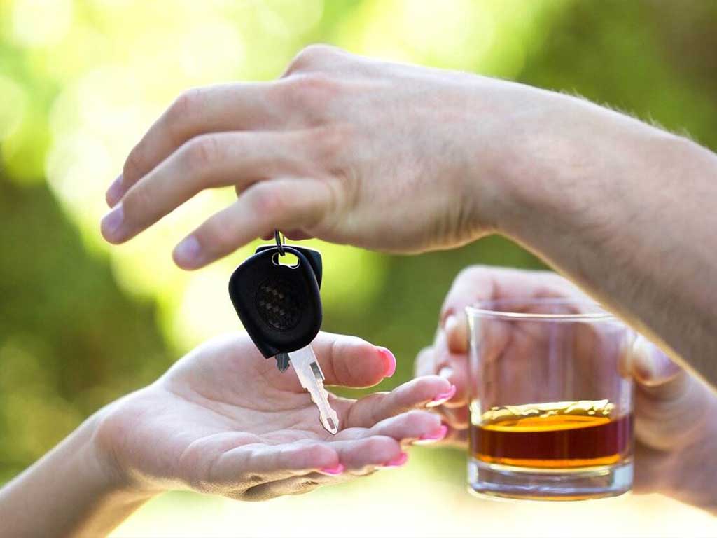 A person giving their car keys to another person