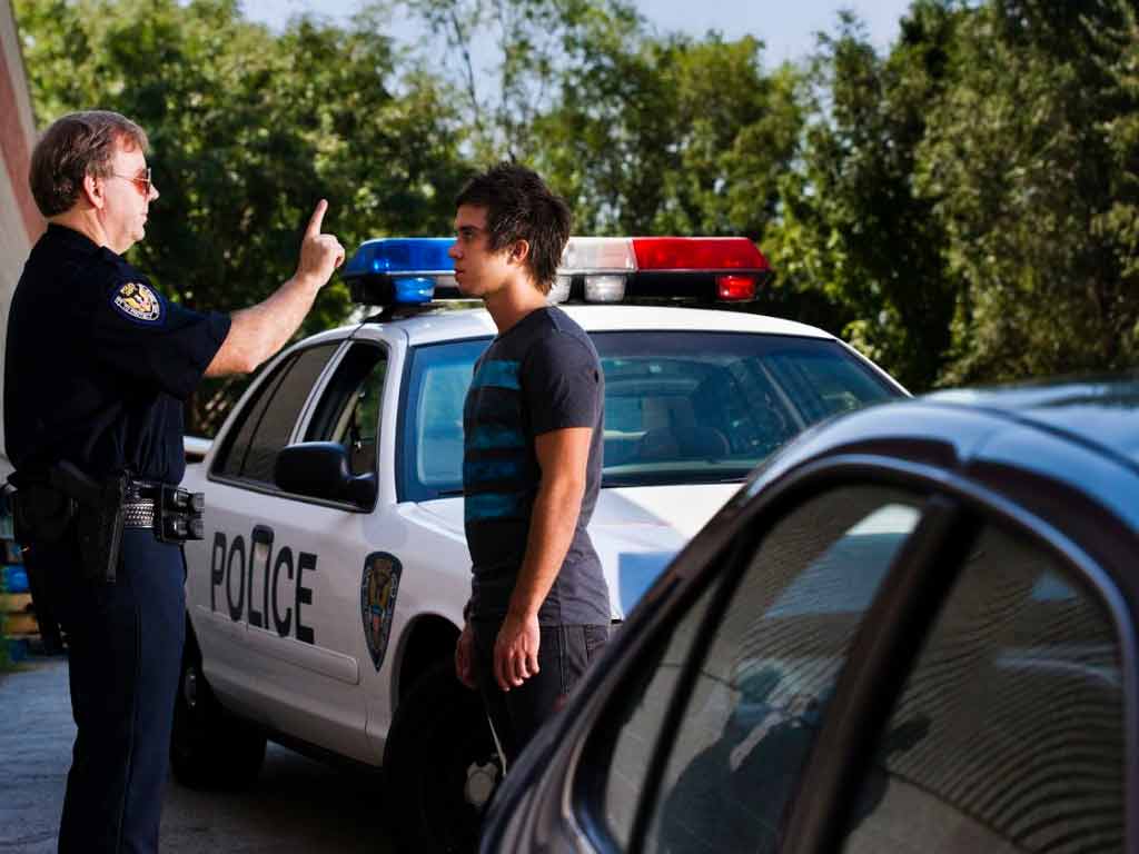 A police officer conducting a sobriety test