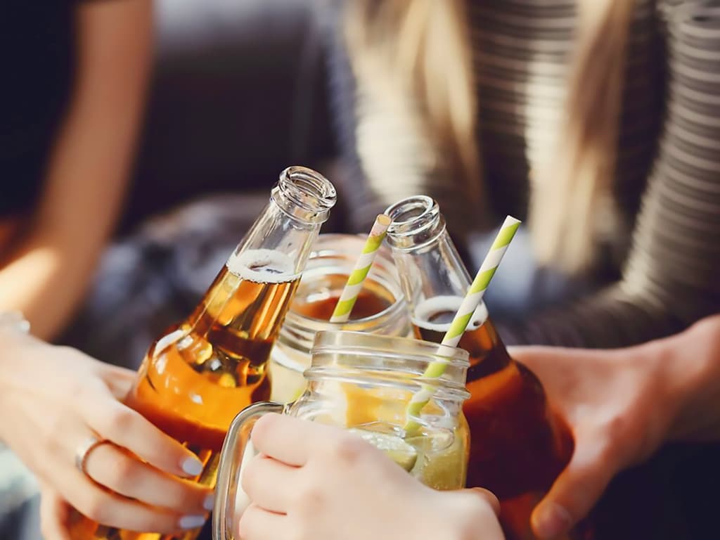 A group clinking their drinks together