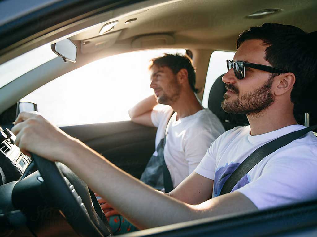 Two men in a car travelling