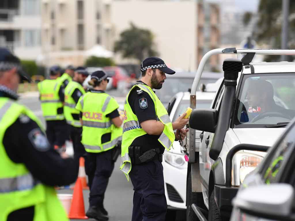 A police officer conducting a roadside drug testing