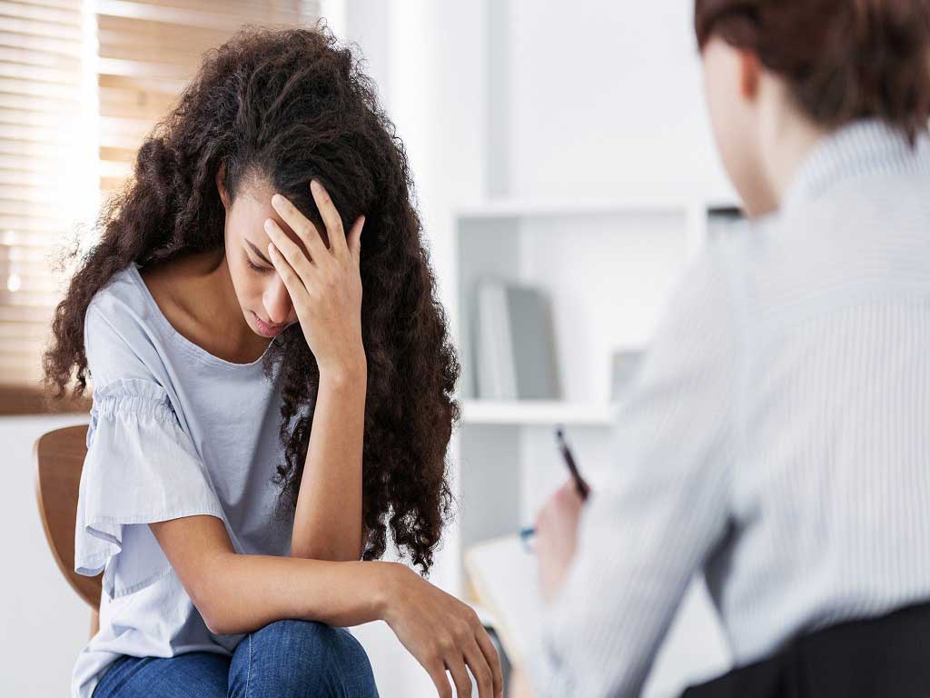 Woman undergoing a therapy session with a counsellor