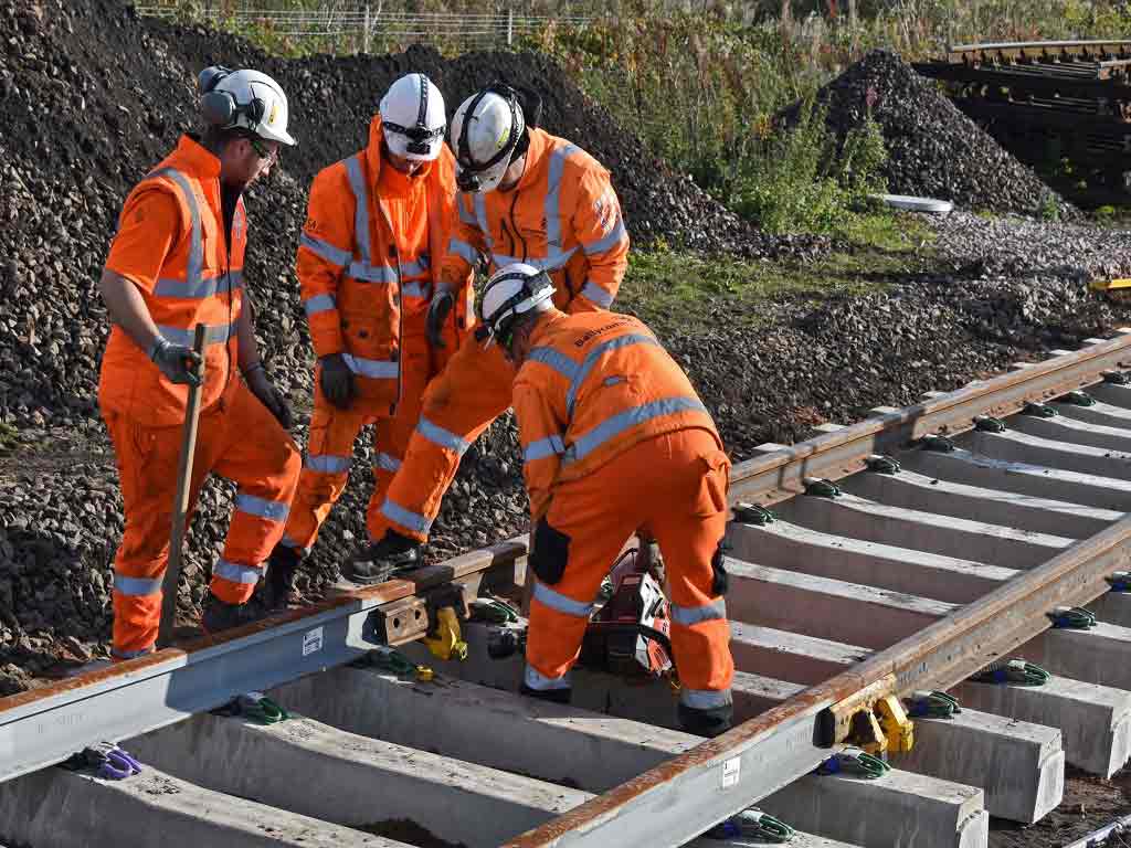 dot drug and alcohol testing Railway workers fixing a track
