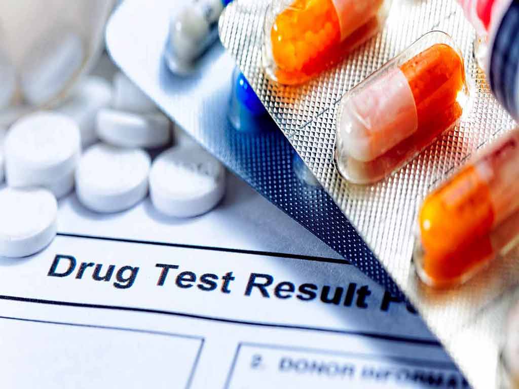 drug testing adelaide. 1 1 2 A drug test result and various drugs in the background