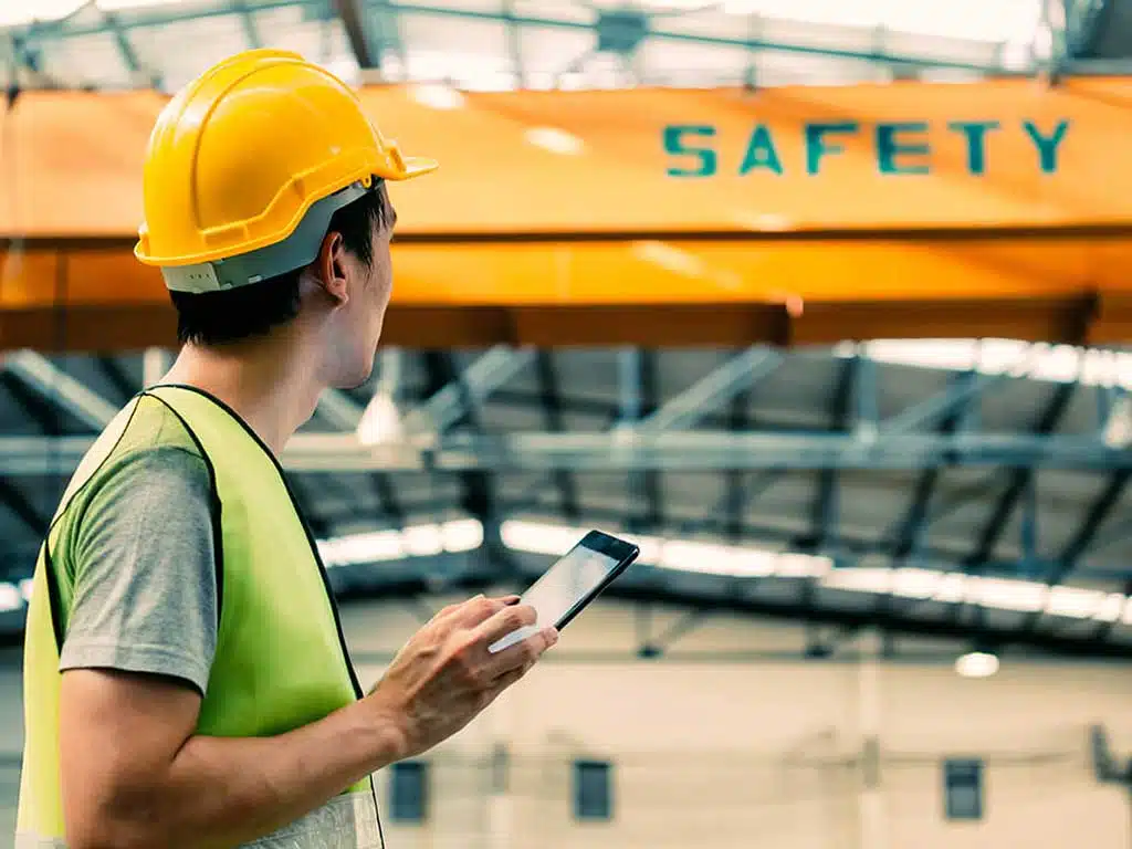 construction worker looking at equipment on site